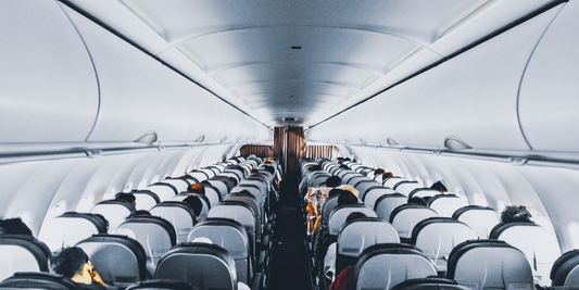 The inside of a commercial plane is seen.