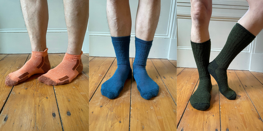 Orange alpaca ankle socks on the left. Blue alpaca crew socks in the middle. Dark green alpaca boot socks on the right.