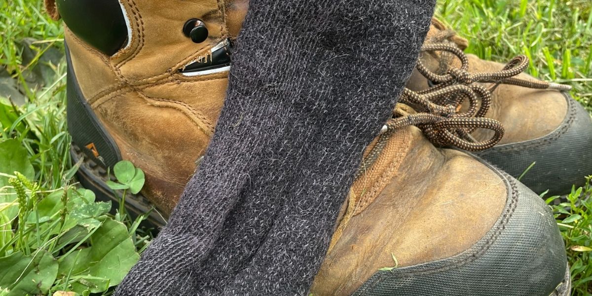 heavy boots with a sock in grass
