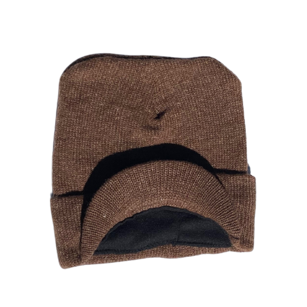 a brown knit hat with a brim on a white background